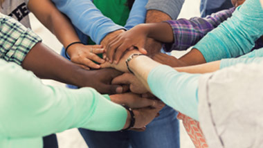 Hands joined in solidarity