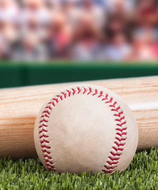 baseball and bat on turf